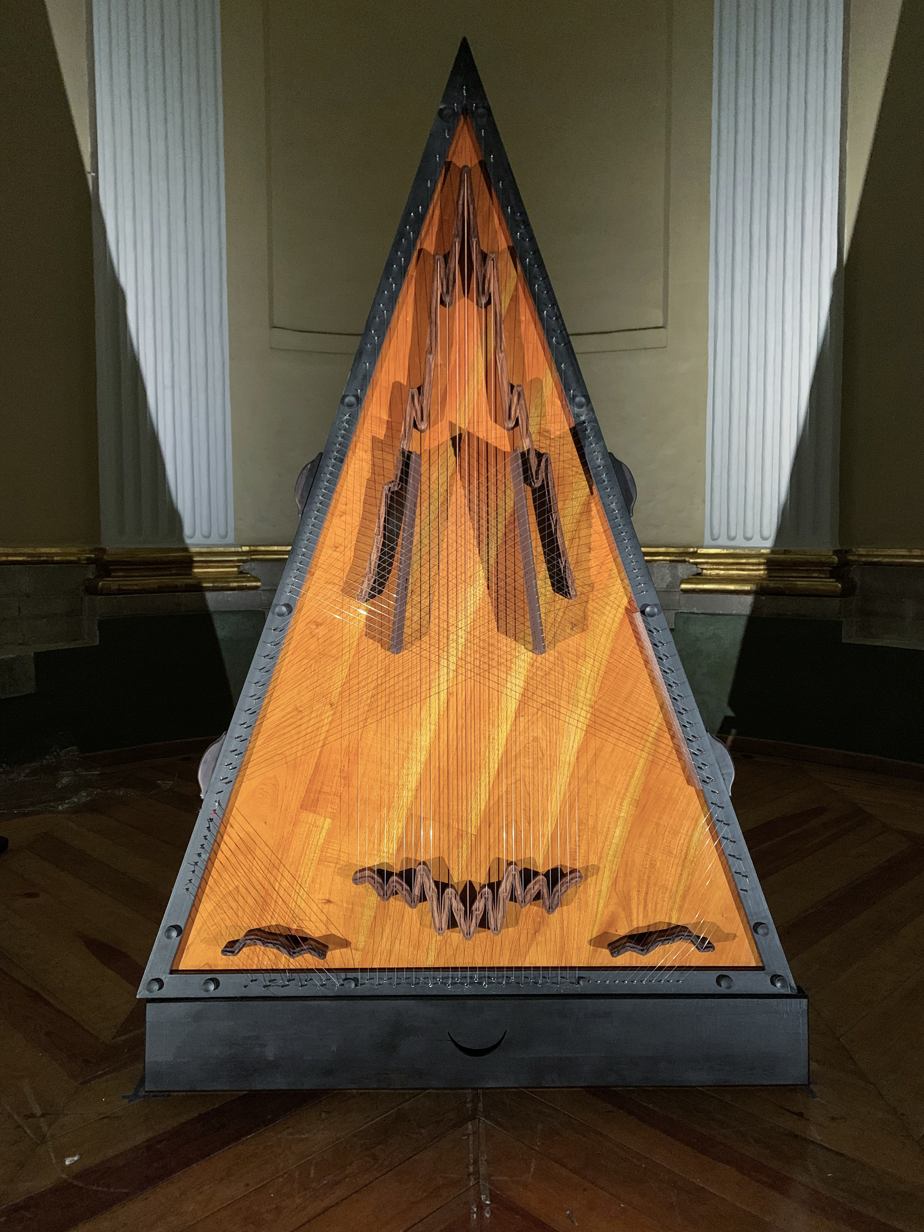 Citrapataṃga Brevicornis, 2022.  
Ximena Labra, Leonardo Heiblum. Collaboration with luthier Carlos Chinchillas.
Instrumento musical para 12 manos, escultura sonora. Tabla armónica: madera de cedro con puentes tallados de chagane. 108 cuerdas: piano, arpa de concierto, arpa jarocha,  jarana, sitar, y salterio. Cuerpo: maderas de chechen y katalox, herrería y acero. 

Musical instrument for twelve hands, sound sculpture. Harmonic table: cedar wood with carved chagane wood bridges. 108 strings: piano, concert harp, Jarocha harp, jarana, sitar and psaltery strings. Body: chechen and katalox woods. Iron and steel. 
2.7 x 1.8 x 1.3 m 
