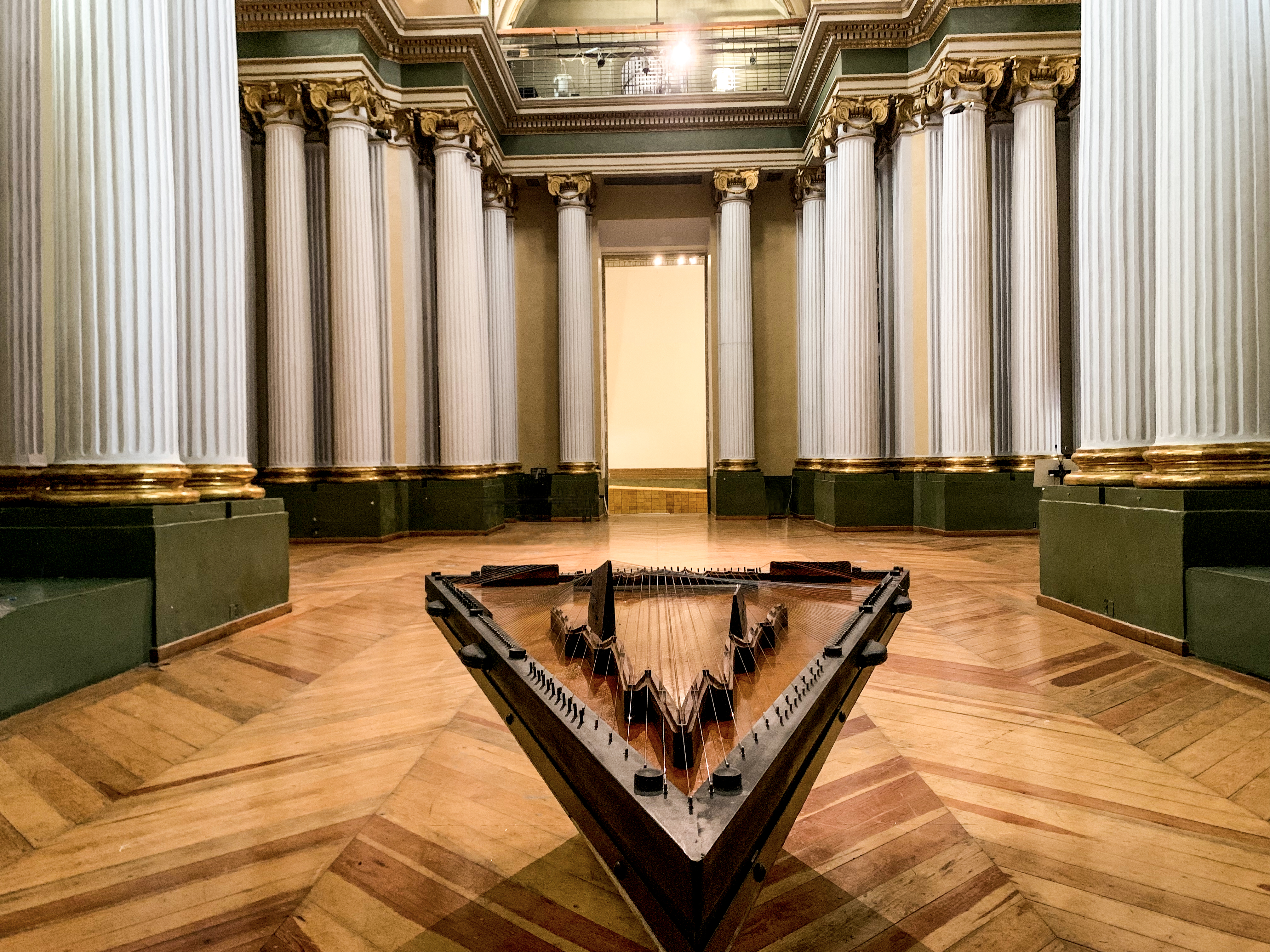 Citrapataṃga Brevicornis, 2022.  
Concept: Ximena Labra, Leonardo Heiblum. Collaboration with luthier Carlos Chinchillas.

Musical instrument for twelve hands, sound sculpture. Harmonic table: cedar wood with carved chagane wood bridges. 108 strings: piano, concert harp, Jarocha harp, jarana, sitar and psaltery strings. Body: chechen and katalox woods. Iron and steel. 
2.7 x 1.8 x 1.3 m 
